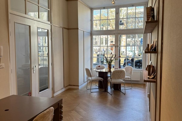 Multifunctional modern space in 17th century canal house on streetlevel with display windows