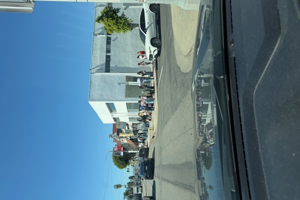 Photo of High-Visibility Full-Building Retail Canvas at a Prime Melrose Intersection